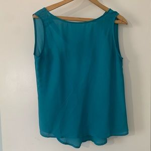 Turquoise sleeveless blouse